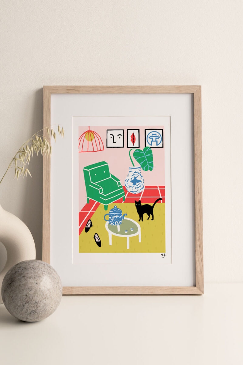 Living Room Art Print portrays a room with a sofa, tea table with a tea pot and black cat